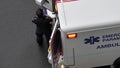 Aerial view of a medical team putting the medical equipment back on the ambulance car