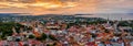 Aerial view of the medieval, beautiful walled city of Tallinn gleaming under the sunset in Estonia