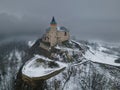 Old medieval castle Kuneticka hora during winter storm