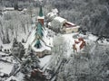 Aerial view of medieval church in Kaliningrad former Konigsberg, Russia in winter and forest with snow