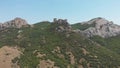 Aerial view on medieval fortress on top of the mountain, fortifications, in the background mountains. VFX