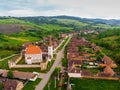 Aerial view. Medieval Saxon Church in Saschiz Village, Transylvania, Romania. Unesco World Heritage Site. fortified church and the Royalty Free Stock Photo