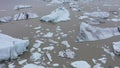 Aerial view of melting glacier and floating icebergs as result of Atlantic ocean meridional overturning circulation collapse