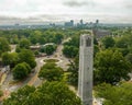 Aerial view of the Memorial Belltower surrounded by lush vegetation