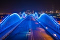 Aerial view of the Meydan Bridge and street road or path way on highway with modern architecture buildings in Dubai Downtown at