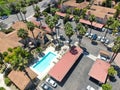 Aerial view middle class neighborhood condo community swimming pool, South California