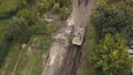 Aerial view military soldiers sittingon moving army tank on shooting training