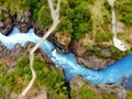 The aerial view of the milky blue river and a bridge near Barnafoss Falls, Iceland