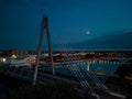 Aerial view of the Millennium Bridge over Southport Marine Lake at night with moon rise, Southport