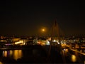 Aerial view of the Millennium Bridge over Southport Marine Lake at night with moon rise