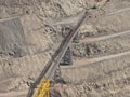 Aerial view of mineral conveyor belts from the bottom of the mine pit to processing plants Royalty Free Stock Photo