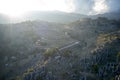 Aerial view of misty mountain valley with rock formations. Royalty Free Stock Photo