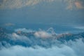 Aerial view of misty mountains at sunrise