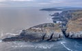 Aerial view with Mizen Head Lighthouse with spectaculars cliffs in West Cork Ireland Royalty Free Stock Photo