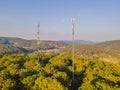 Aerial view of mobile phone antenna station tower in Swiss alps. Wireless communication in mountain area Royalty Free Stock Photo