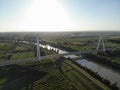 Aerial view of a modern bridge over a river in northern Italy. Royalty Free Stock Photo