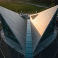 Aerial view of a modern building with a striking design, featuring triangular, angular