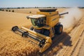 Aerial view of modern combine harvester in action harvesting wheat at summer agricultural field Royalty Free Stock Photo