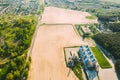 Aerial View Modern Granary, Grain-drying Complex, Commercial Grain Or Seed Silos In Sunny Spring Rural Landscape. Corn Royalty Free Stock Photo