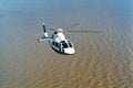 aerial view of a modern helicopter with 2 squalls flying over the - rio de la plata -, buenos aires, photo maqueira Royalty Free Stock Photo