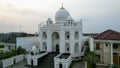 Aerial view of modern Masjid Ramlie Musofa in Jakarta Kemayoran with Jakarta cityscape. JAKARTA, INDONESIA : MAY 18, 2021