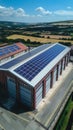 Aerial view of a modern warehouse with solar panels on the roof an aerial drone photo. Royalty Free Stock Photo