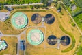 Aerial view of modern water cleaning facility at urban wastewater treatment plant. Purification process of removing undesirable