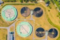 Aerial view of modern water cleaning facility at urban wastewater treatment plant. Purification process of removing undesirable