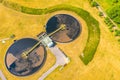 Aerial view of modern water cleaning facility at urban wastewater treatment plant. Purification process of removing undesirable