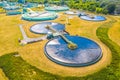 Aerial view of modern water cleaning facility at urban wastewater treatment plant. Purification process of removing undesirable