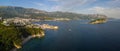 Aerial view of Mogren beach two sandy beaches and the old city stari grad of Budva, and Sveti Nikola island. Montenegro.