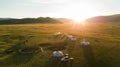 Aerial view of Mongolian ger community at sunset.