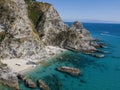 Aerial view of moored boats floating on a transparent sea. Scuba diving and summer holidays. Capo Vaticano, Calabria, Italy