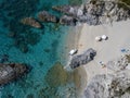 Aerial view of moored boats floating on a transparent sea. Scuba diving and summer holidays. Capo Vaticano, Calabria, Italy