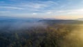 Aerial view of morning sunrise of tropical rainforest at dawn with misty and foggy cloud during summer for the outdoor mountain va Royalty Free Stock Photo