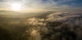 Aerial view of morning sunrise of tropical rainforest at dawn with misty and foggy cloud during summer for outdoor mountain valley Royalty Free Stock Photo