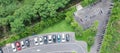 Aerial view of motorcycles parking row and car parking. Royalty Free Stock Photo