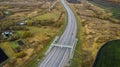 Aerial view of motorway intersections, of speeding cars and trucks