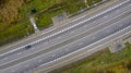 Aerial view of motorway intersections, of speeding cars and trucks