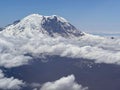 Aerial view of Mount Ranier in snow and clouds in Washington Royalty Free Stock Photo