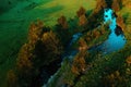 Aerial view of mountain creek winding through beautiful grassy landscape on Zlatibor, Serbia