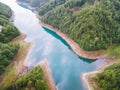 Aerial view of a mountain lake in the morning mist