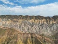 Aerial view mountain over blue sky. Drone view mountain valley. Beautiful view from above surface of mountain hills Royalty Free Stock Photo