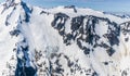 An aerial view a mountain peaks and sheer walls above the Denver glacier close to Skagway, Alaska Royalty Free Stock Photo