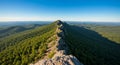 Aerial View of Mountain Ridge, Lush Green Forest, Blue Sky Royalty Free Stock Photo