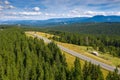 Aerial view of a mountain road in Bucovina Romania withe amazing forest landscape next to it Royalty Free Stock Photo
