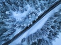 Aerial view of mountain road in fairy forest in snow in winter Royalty Free Stock Photo