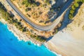 Aerial view of mountain road near blue sea with sandy beach Royalty Free Stock Photo