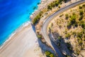 Aerial view of mountain road near blue sea with sandy beach Royalty Free Stock Photo