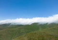 Aerial view mountain. Scenic aerial view mountain ridge. Above green landscape with sunlight mountains covered with clouds Royalty Free Stock Photo